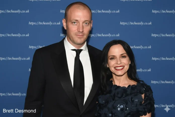 Brett Desmond posing at a formal event